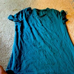 This is a woman’s large, green t-shirt